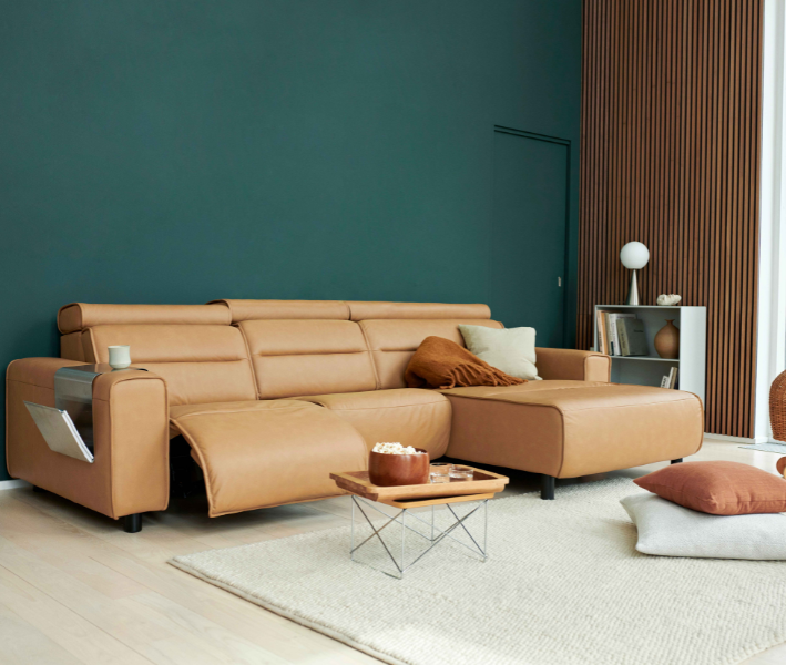 With sleek lines and a streamlined silhouette, Stressless Emily has a clean, modern look that exhibits confidence and style. The contemporary design blends effortlessly with any modern interior, while the soft cushions ooze with luxury and invite you to take a seat and relax. As one of the Stressless Power sofas, you can easily adjust the position of the footrest.
The Emily has an adjustable headrest on all seat modules so you can lower it for a sleek low-back sofa with perfect back support for sitting, or adjust the angle and height of the headrest for extra support to your head and neck.
Stressless Emily also offers a large choice of high-quality leather and fabrics, and the choice between three versions of armrests: Emily Steel and Emily Wood have slim armrests with elegant details in steel or wood, while Emily Wide has distinct upholstered armrests with luxuriously large proportions. You can also customise the layout of your sofa with modular options to create the sofa of your dreams.
Please note that we only show a limited number of configurations on our website - if you require a different configuration please contact us.