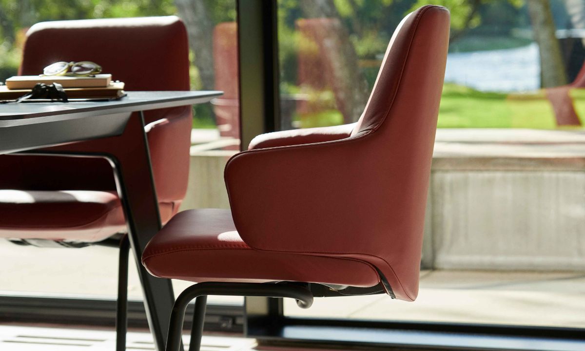 The Stressless Laurel dining chair brings the renowned comfort of Stressless into the heart of your home - the dining room. With its streamlined design and sculpted backrest, the Laurel combines refined style with exceptional functionality.
Equipped with BalanceAdapt™ technology and the Glide-system, the chair subtly moves with your body as you sit, lean, or shift, offering a more relaxed and natural dining experience. Whether you’re hosting guests or enjoying a quiet meal, the Laurel ensures long-lasting comfort without compromising on aesthetics.
Available in medium or large with high or low backrests, and a choice of wood or metal legs plus a variety of leather and fabric finishes, the Laurel can be tailored to match your personal style and dining space perfectly.